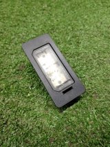 63267193293, V20840013, L042100005LED, 4442102NAQ, BM0244350 Фонарь подсветки номера BMW X1 2010 фото 6
