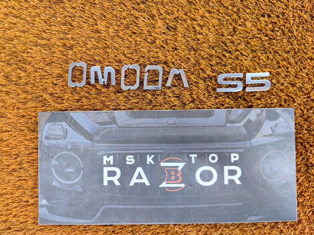 609002307AA Эмблема Omoda S5 2023 фото 2