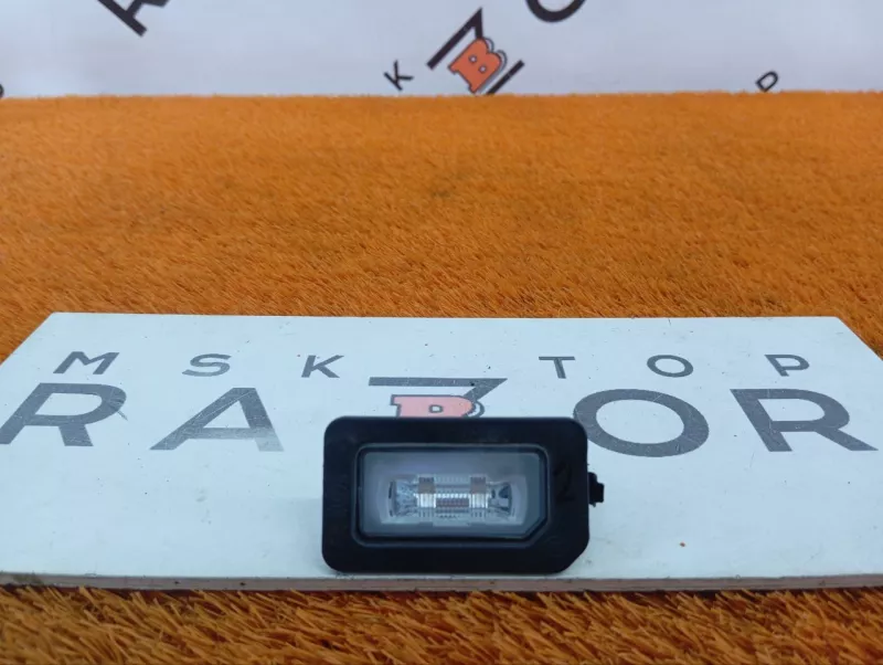 Фонарь подсветки номера