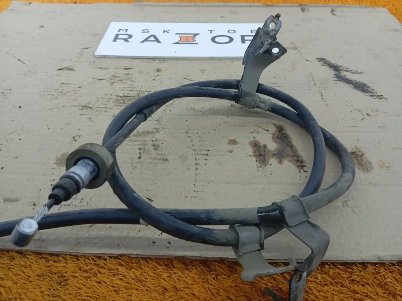 Трос стояночного тормоза