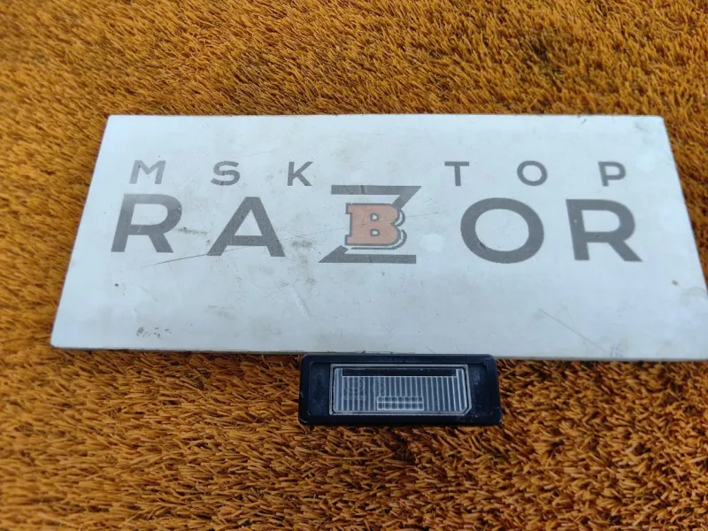 Фонарь подсветки номера