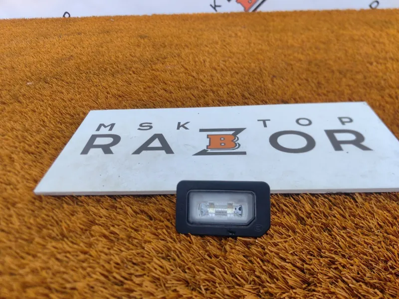 Фонарь подсветки номера