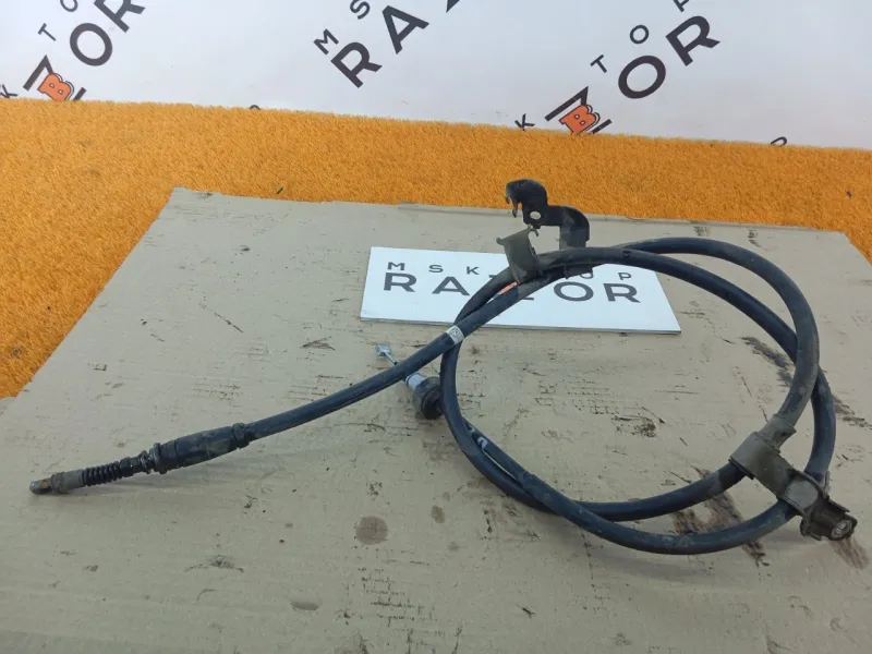 Трос стояночного тормоза